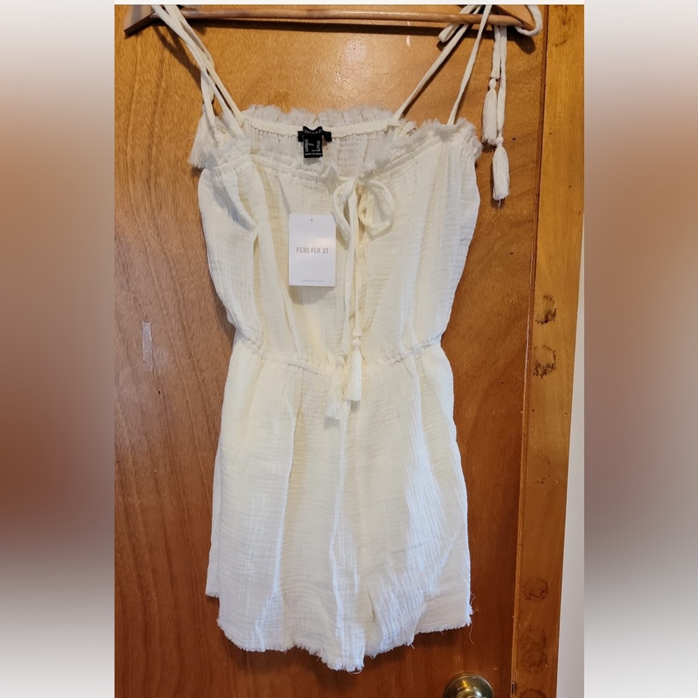 Brand new with tags cream color romper